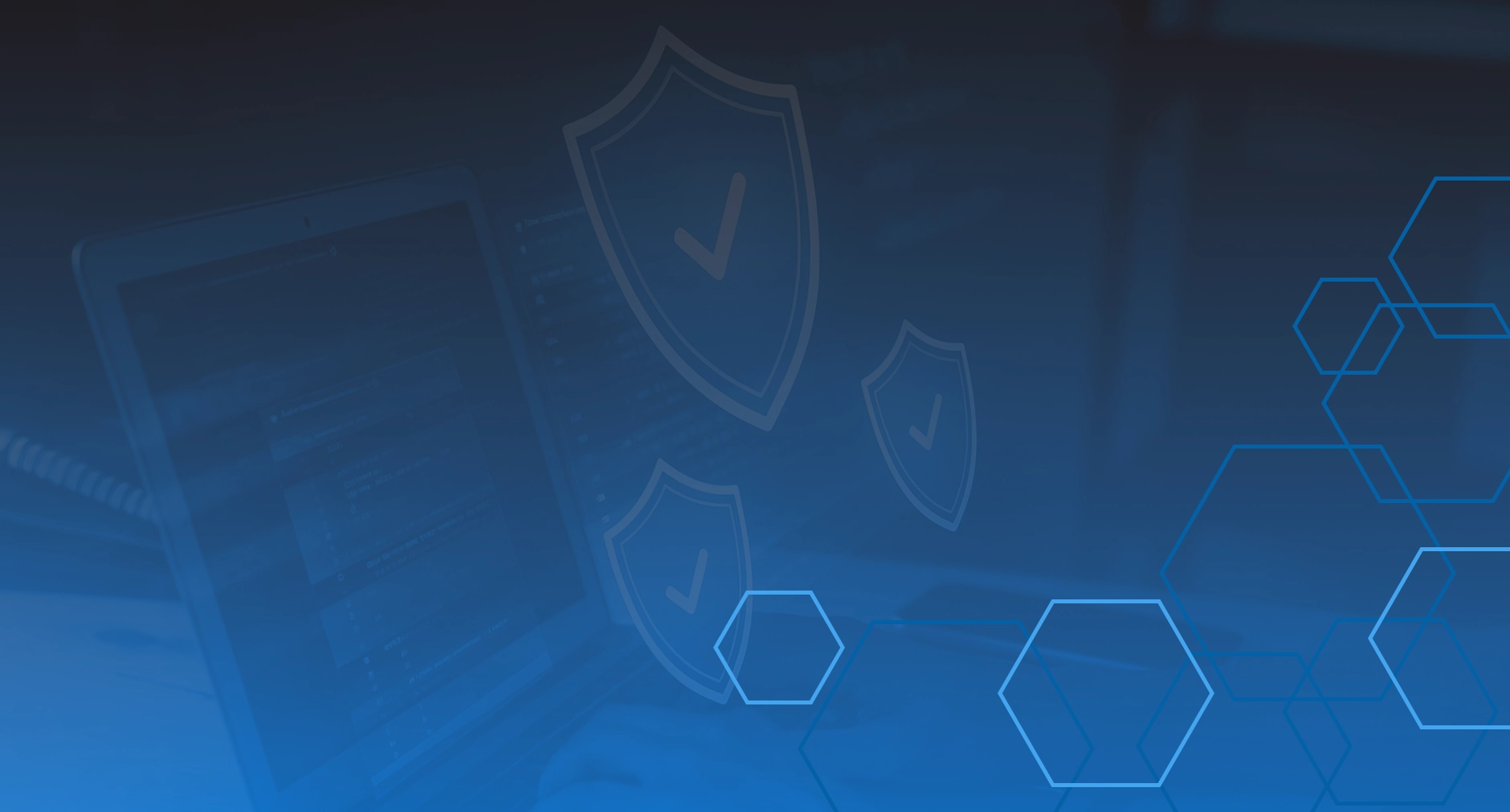 Laptop with code on screen and digital security shields in a blue overlay background