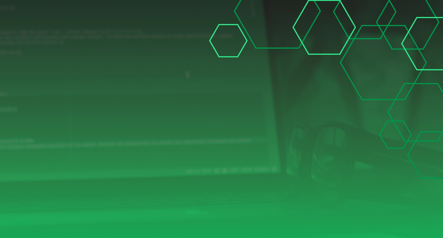 Computer screen with code and eyeglasses on desk, green overlay
