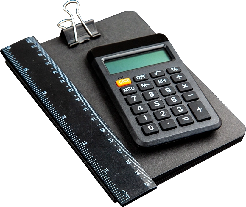 Calculator, clipboard, and ruler representing office accounting tools